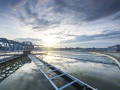 The Solid Contact Clarifier Tank type Sludge Recirculation process in Water Treatment plant with sunrise; Shutterstock ID 334813718; Purchase Order: Group; Job: CD manual